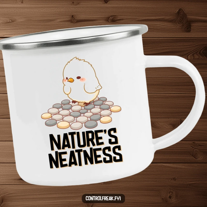 Funny Camping Mug: A small, fluffy bird meticulously arranges pebbles into perfect geometric patterns in an outdoor setting.
