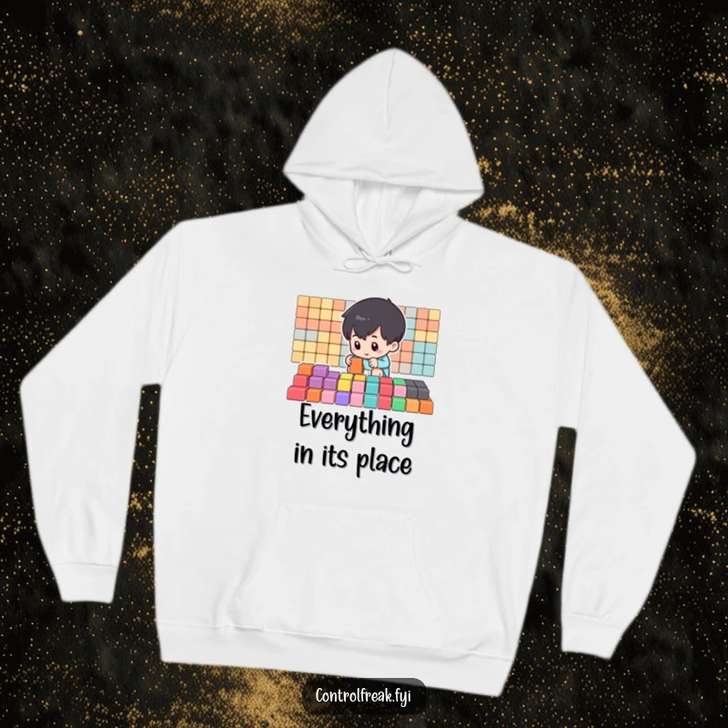 Funny Hoodie depicting a small character meticulously arranging colorful blocks into precise rows, a symbol of dedication to order.