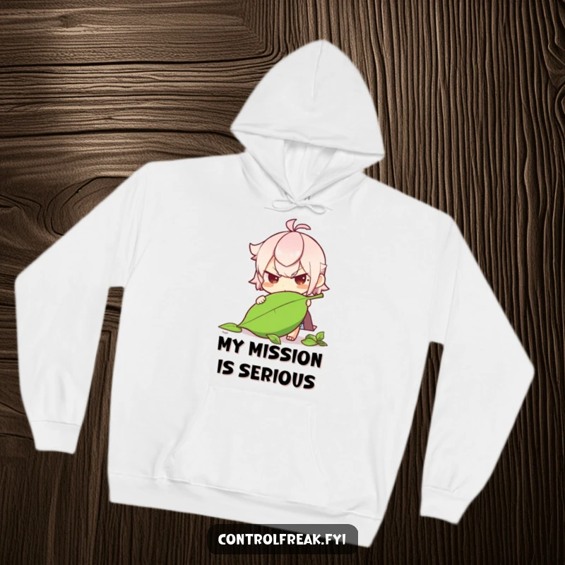 Funny character with a determined expression straightening a fallen leaf on this hoodie, showing care for nature.